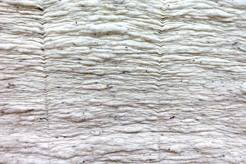 Réserve de tissus en coton biologique dans les entrepôts de Vestitex